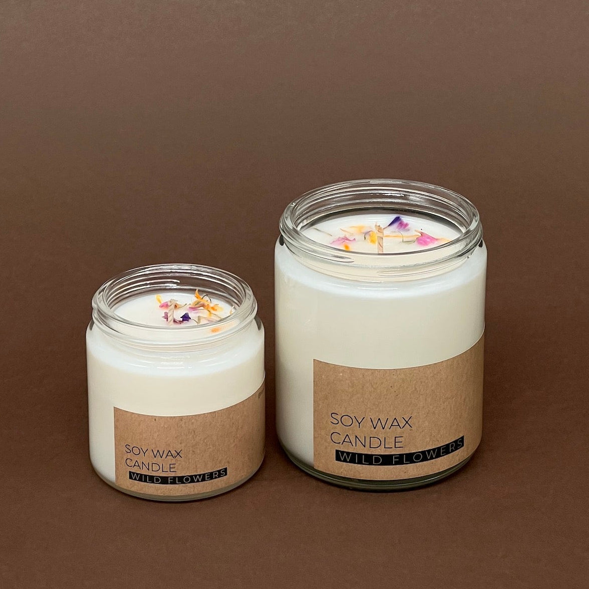 Pļavas ziedu svece stikla traukā