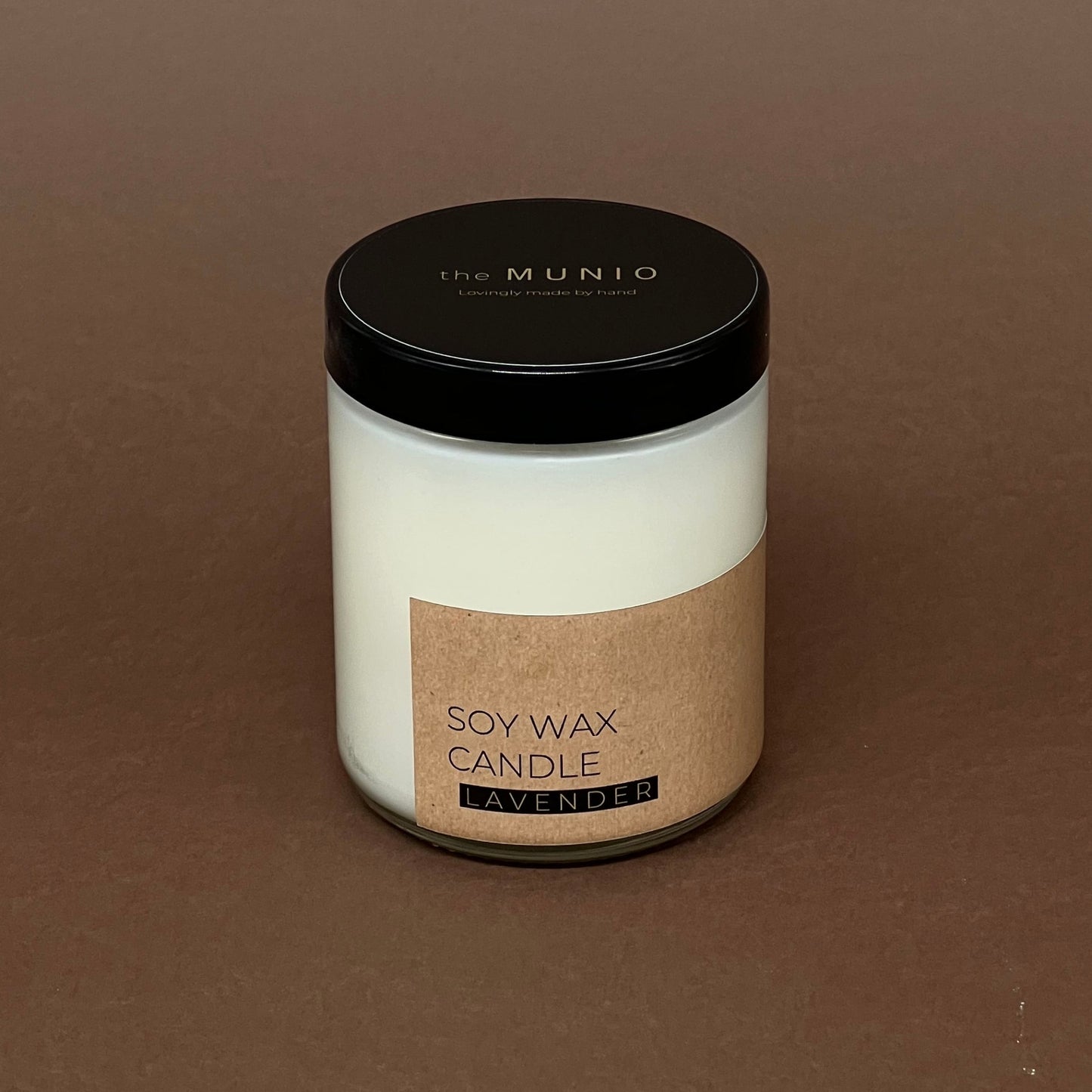 Lavandas svece stikla traukā