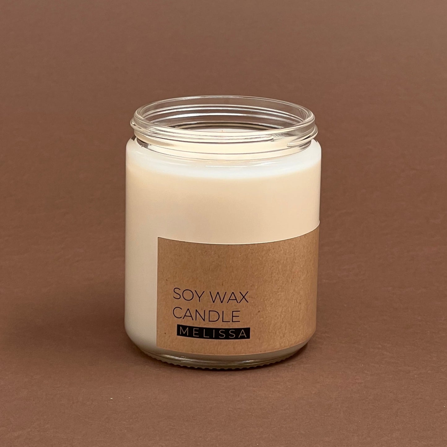 Melisas svece stikla burciņā