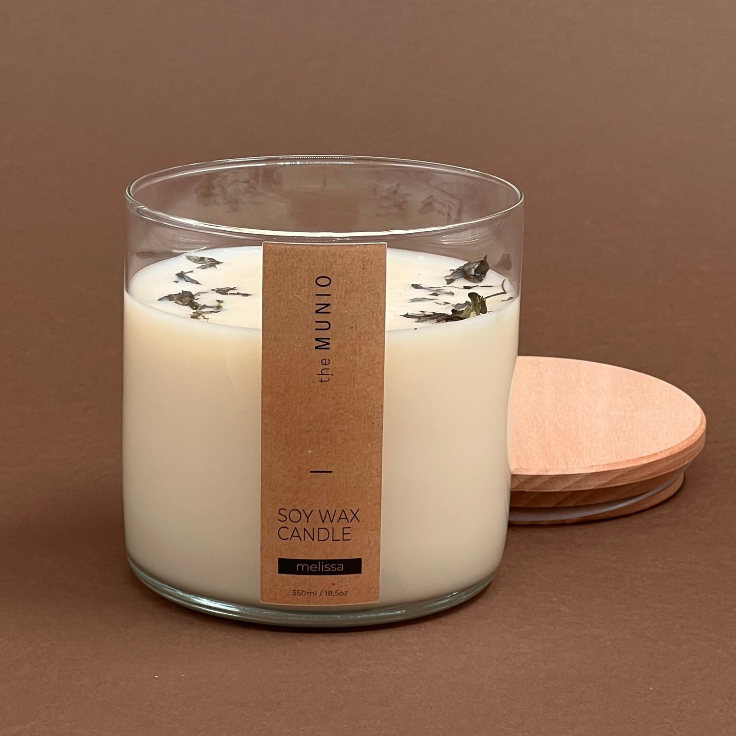 Melisas svece stikla traukā