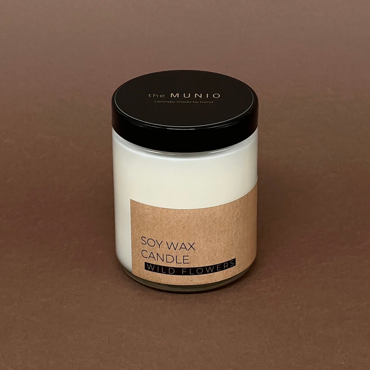 Pļavas ziedu svece stikla traukā